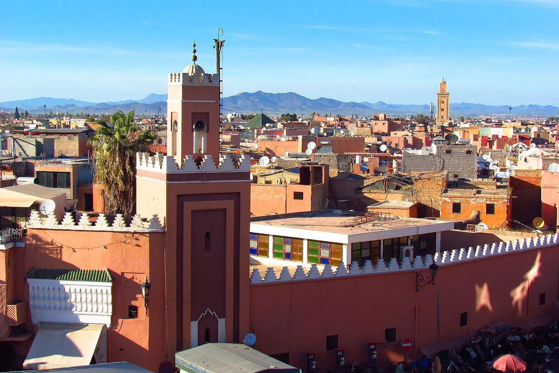 Rooftops and minarets of Marrakech with the Atlas Mountains beyond