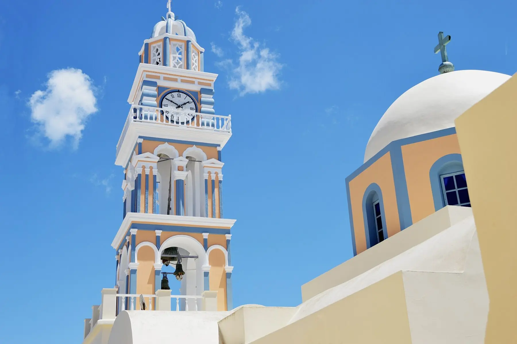 The bell tower and dome of St John the Baptist Cathedral in Fira, Santorini, Greece