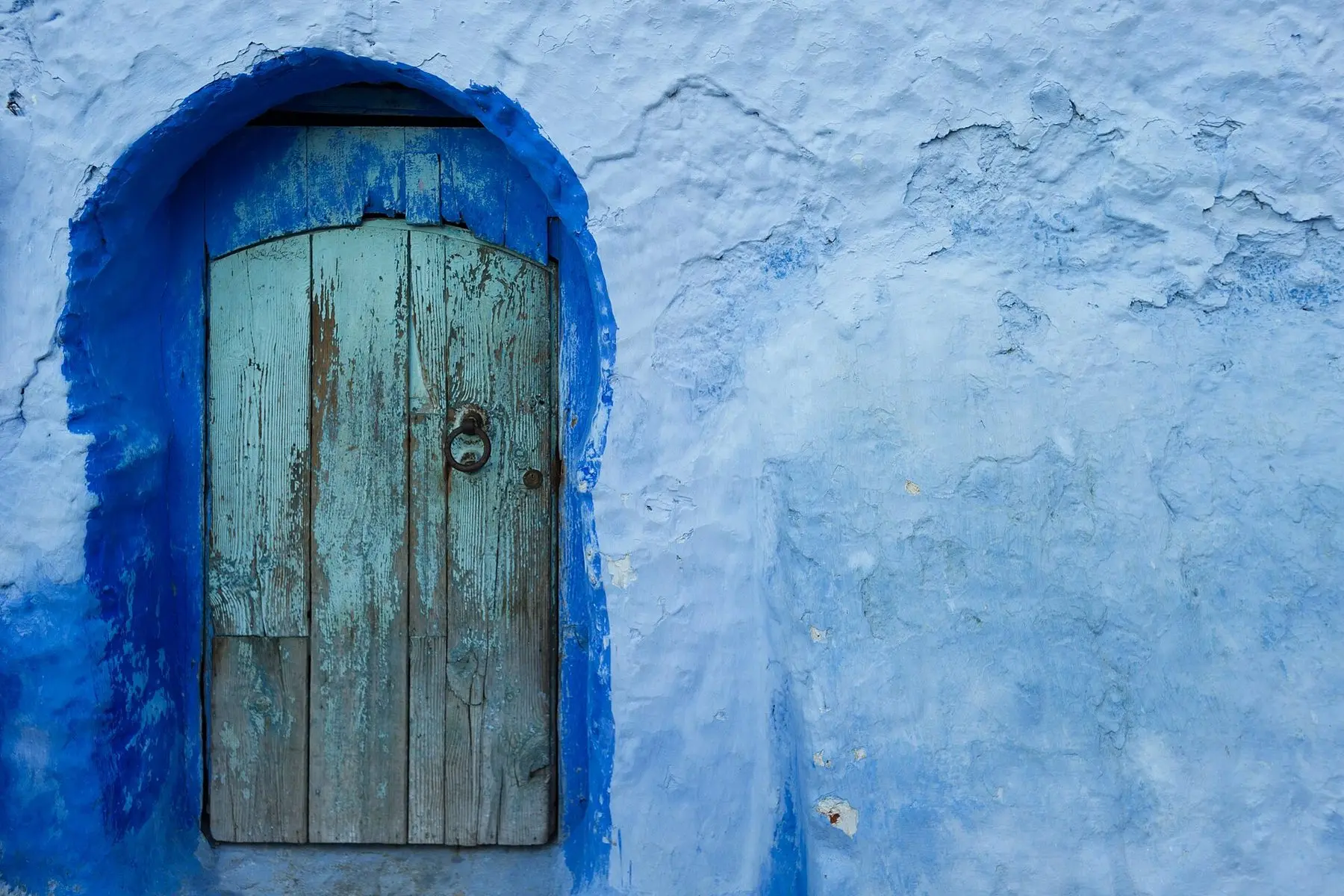 A blue-washed doorway in the old town of Chefchaouen, Morocco